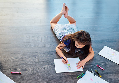 Buy stock photo Female child, picture and drawing on ground in house with color pencil for development. Girl, playing and learning in home with crayon or paper for kindergarten, homework and homeschool education