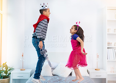 Buy stock photo Bed, playing and portrait of children in dress up for sibling bonding, relax and fun together. Family, happy and young girl and boy for childhood, youth and jumping on holiday, weekend and vacation