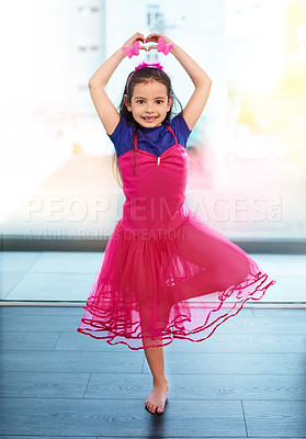 Buy stock photo Full length shot of an adorable little girl showing off her ballet moves at home