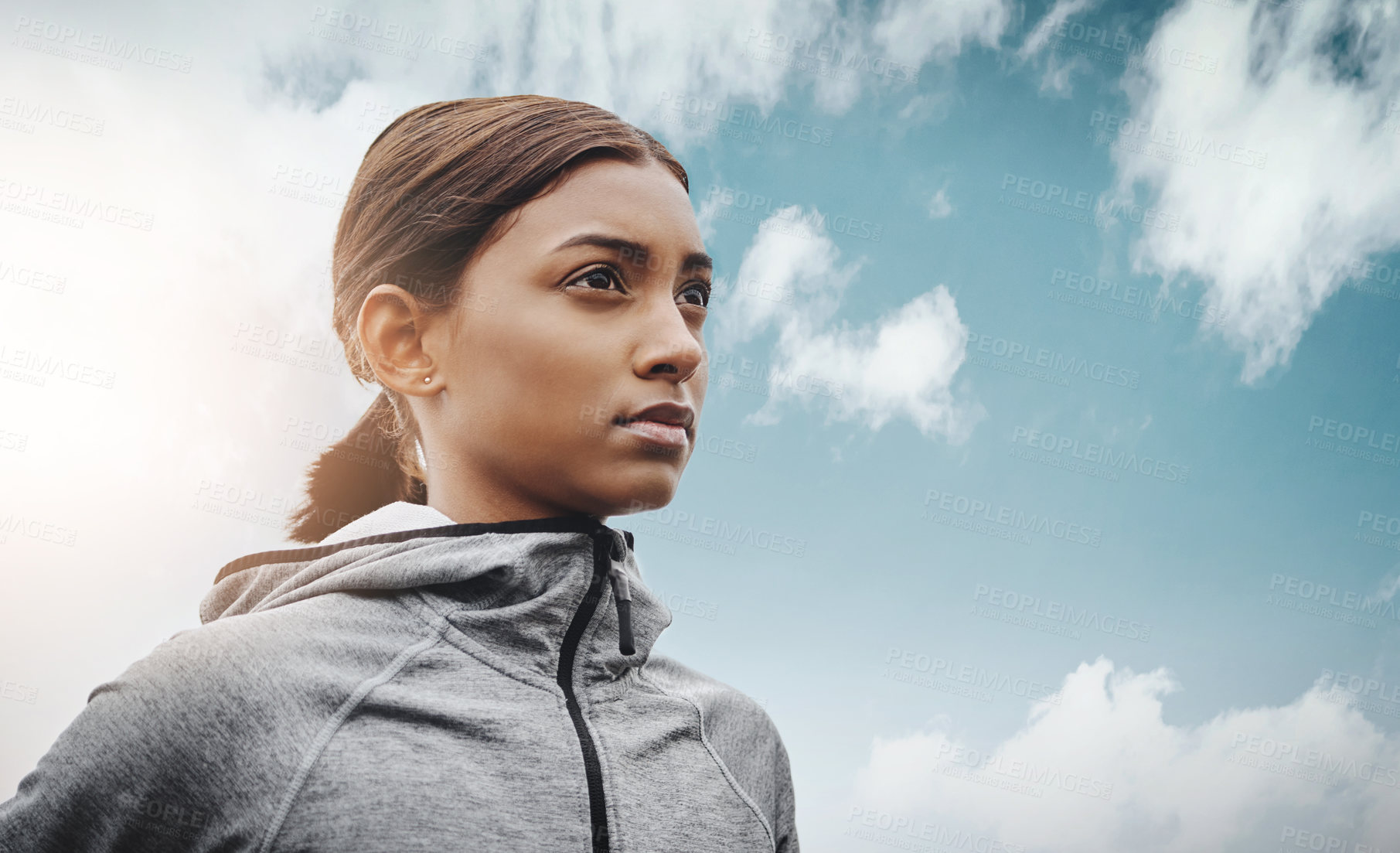 Buy stock photo Sky, runner and Indian woman with focus, training and exercise with workout goal, target and balance. Female person, mockup space and athlete with wellness, concentration and energy with cardio