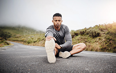 Buy stock photo Man, portrait and stretching legs on road for fitness or hike with muscle preparation for workout. Serious, wellness and motivation for mindset with training, music and energy for cardio or health