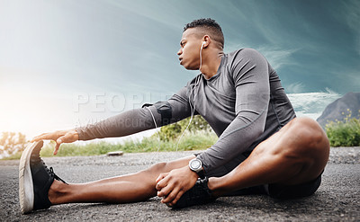 Buy stock photo Shot of a sporty young man exercising outdoors