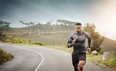 Buy stock photo Man, road running and space in nature for exercise mockup, wellness or music with commitment for health. African male runner, listening and audio for focus, mindset and mock up with workout on street