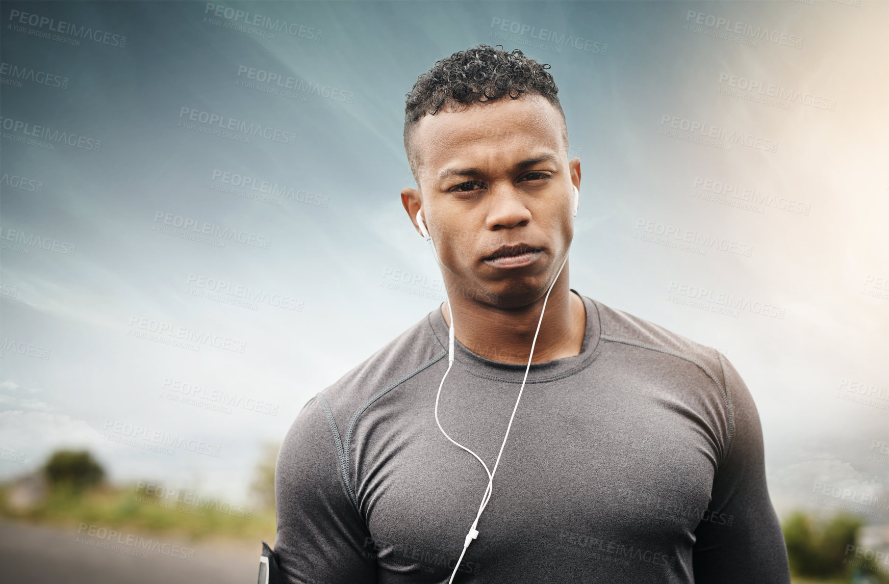 Buy stock photo Fitness, portrait and man serious with music for sports, exercise or audio for motivation. Outdoor, athlete and headset for workout while streaming radio, wellness and healthy for training in nature
