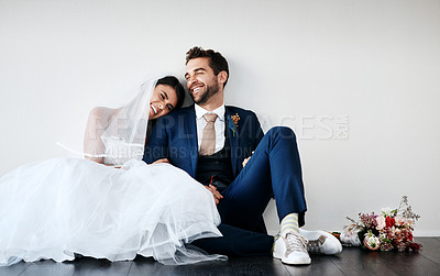 Buy stock photo Couple, wedding and church with laughing, happy and sitting on floor after marriage ceremony and event. Celebration, love and people with smile of bride with funny joke and commitment together