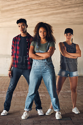 Buy stock photo Shot of a group of dancers practising and posing together in the city