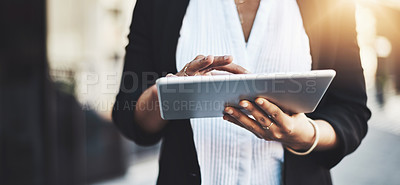 Buy stock photo Closeup shot of a businesswoman using a digital tablet in the city