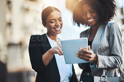 Buy stock photo Happy business people, tablet and smile in city for social media, communication or team collaboration. Woman, friends and smiling in teamwork working on technology for research or networking in town