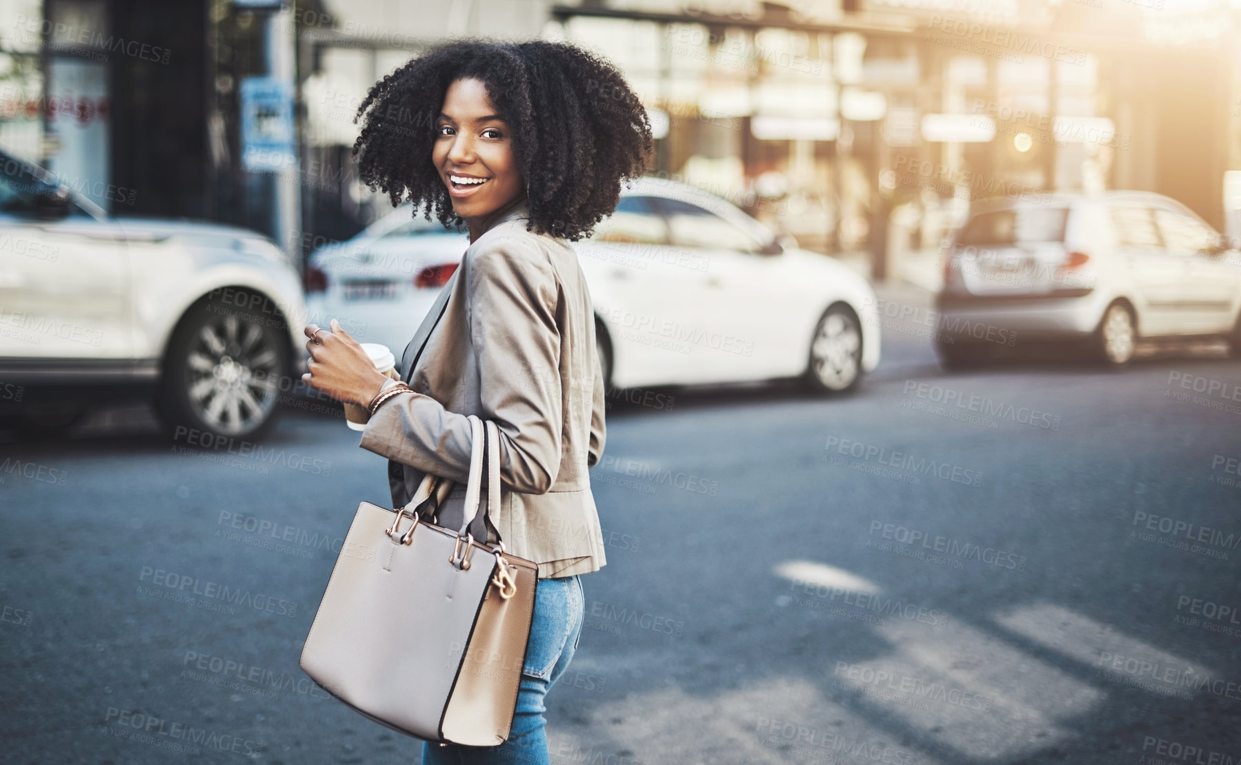 Buy stock photo Portrait of a young businesswoman walking in the city