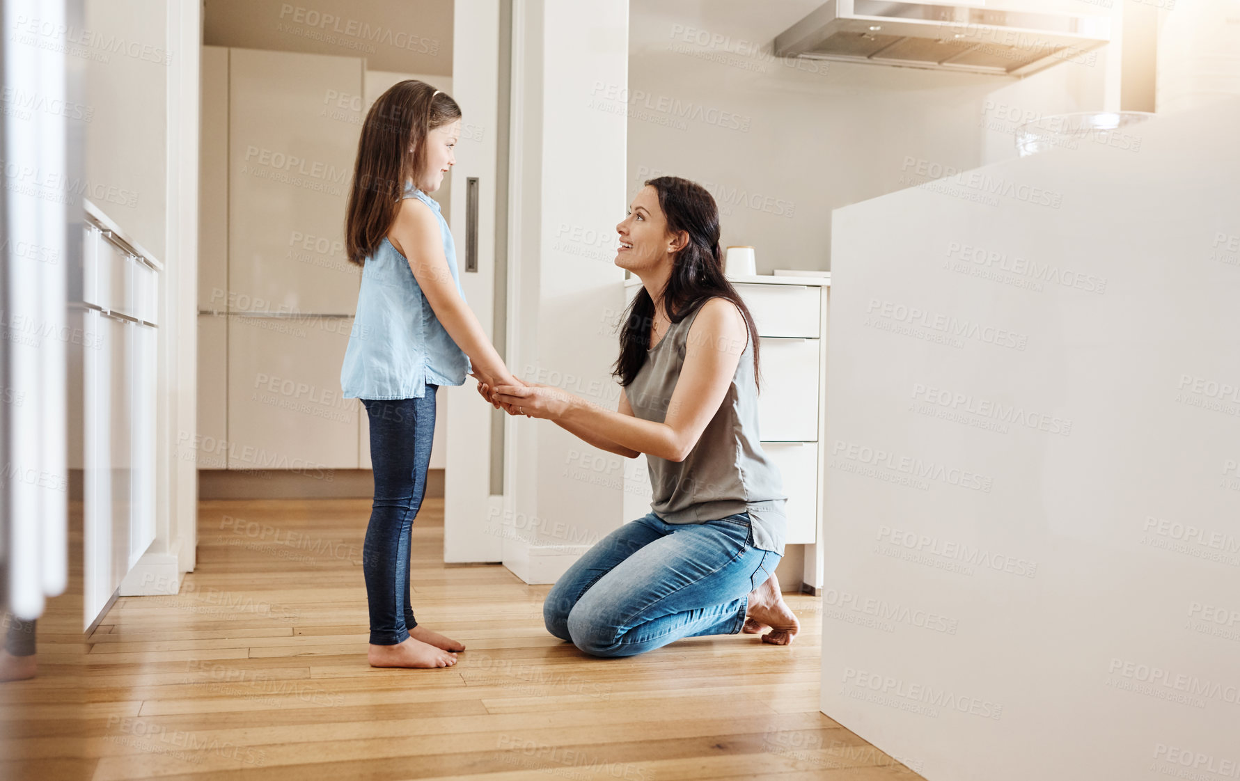 Buy stock photo Shot of an adorable little girl spending time with her mother at home