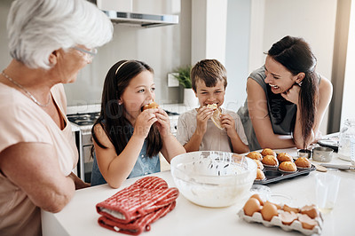Buy stock photo Shot of a happy three generational family baking muffins together at home