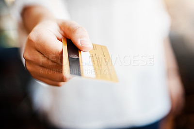 Buy stock photo Cropped shot of an unrecognizable woman holding up her bank card
