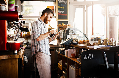 Buy stock photo Digital tablet, research and cafe owner working on a startup cafeteria business plan in a restaurant. Technology, entrepreneur and male barista or waiter checking stock on a mobile in his coffee shop