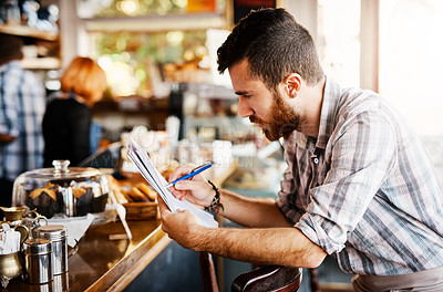 Buy stock photo Coffee shop, writing and man with checklist for menu items, stock and product inventory. Restaurant, cafeteria and business owner with paperwork for planning, client order and documents by counter