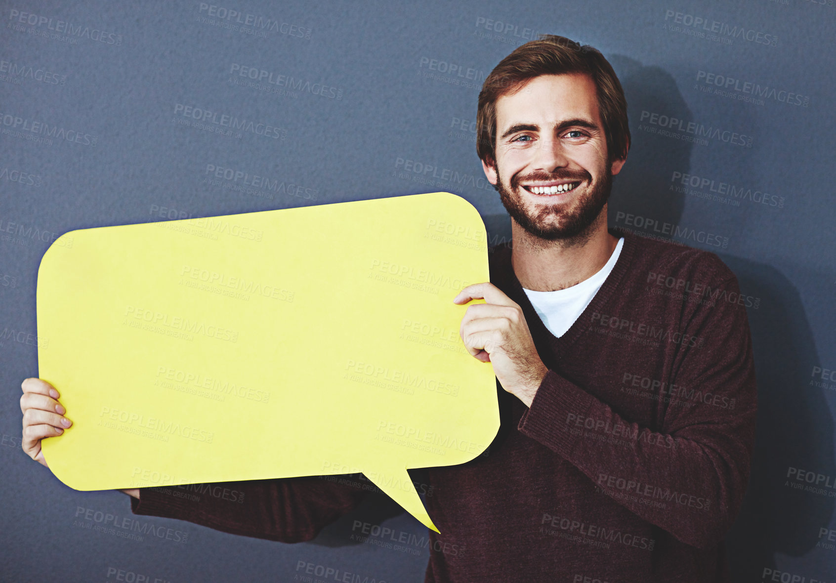 Buy stock photo Businessman, portrait and smile with speech bubble on studio background for FAQ, company announcement or news. Mockup space, cardboard sign and person with poster for opinion, feedback and quote