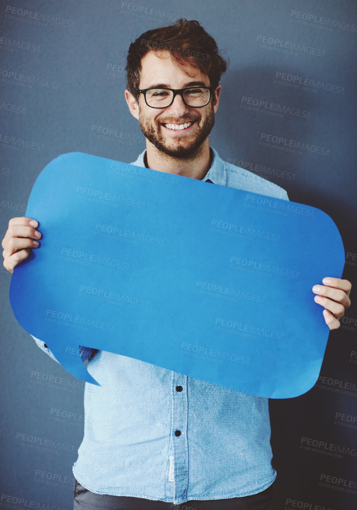 Buy stock photo Businessman, portrait and paper with speech bubble on studio background for FAQ and company announcement. Mockup space, cardboard sign and person with poster for opinion, positive feedback and quote