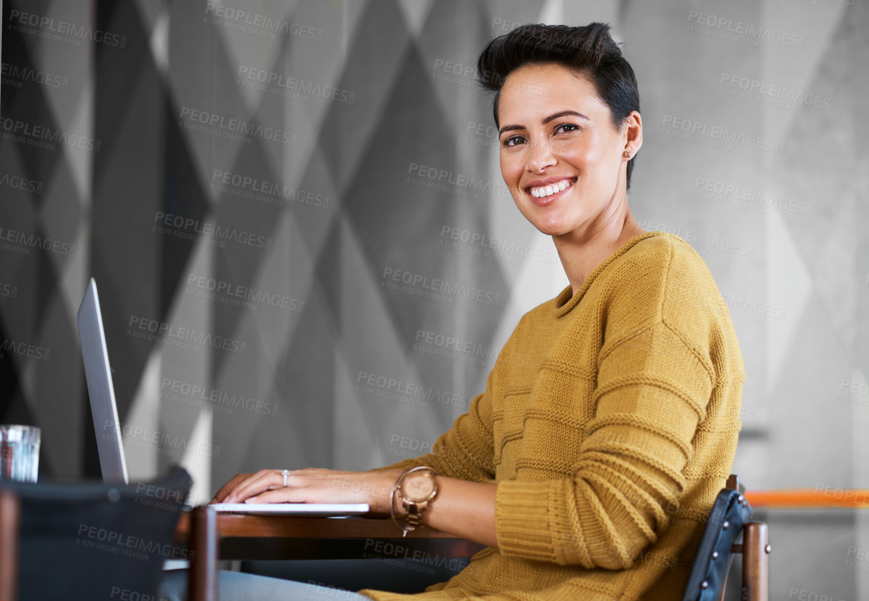 Buy stock photo Cropped portrait of a confident and attractive young businesswoman working in her office
