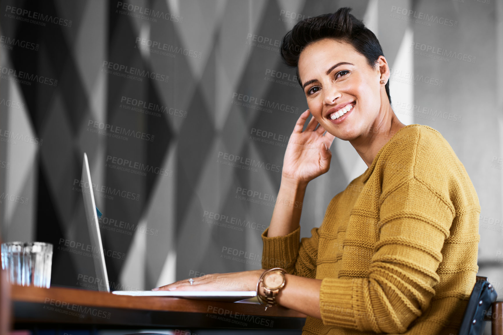Buy stock photo Cropped portrait of a confident and attractive young businesswoman working in her office