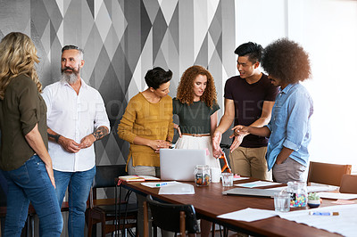 Buy stock photo Cropped shot of a group of designers having a meeting in an office