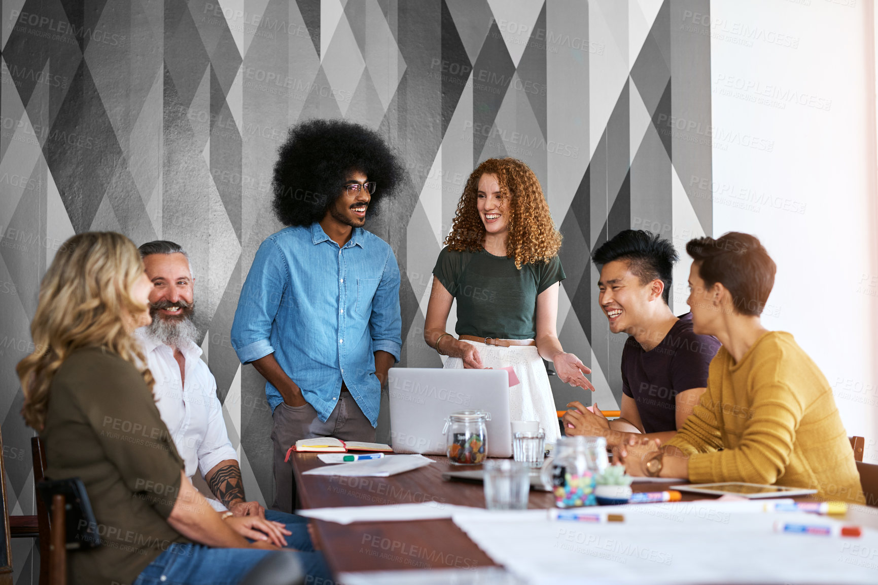 Buy stock photo Cropped shot of a group of designers having a meeting in an office