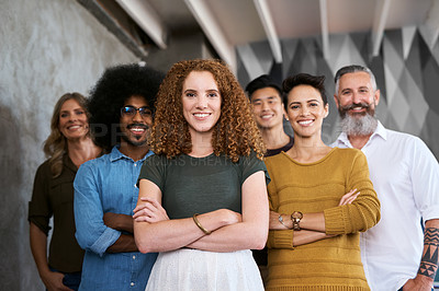 Buy stock photo Cropped portrait of a group of designers standing with their arms folded in a creative office