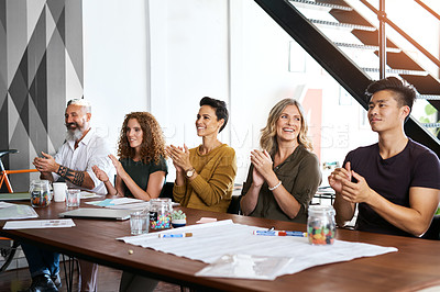 Buy stock photo Cropped shot of a group of businesspeople applauding in an office during a meeting