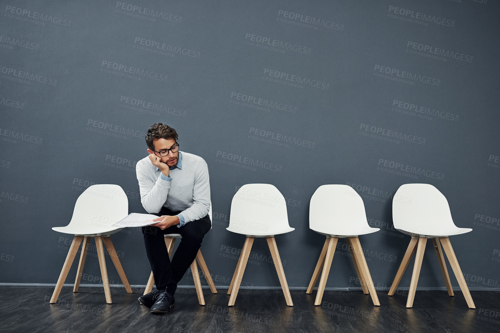 Buy stock photo Recruitment, chairs and row for bored man with vacancy, wait and cv file or book. Hiring, tired and employment candidate mockup with document, work opportunity and queue for human resources interview