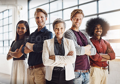 Buy stock photo Portrait of a team of happy designers posing confidently in their modern office