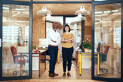 Buy stock photo Portrait of two confident designers standing together in an office