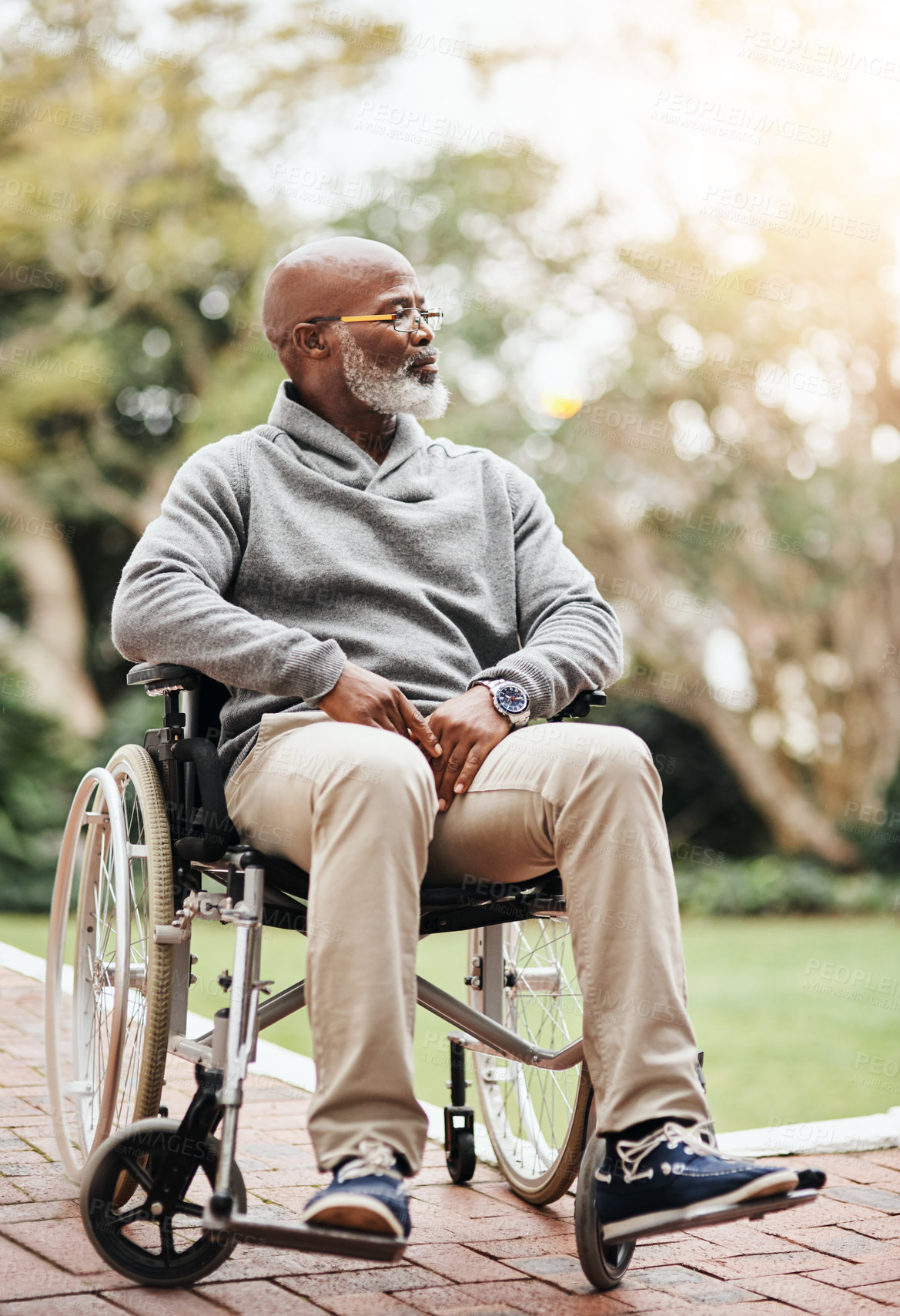 Buy stock photo Full length shot of a handsome senior man sitting in his wheelchair outside