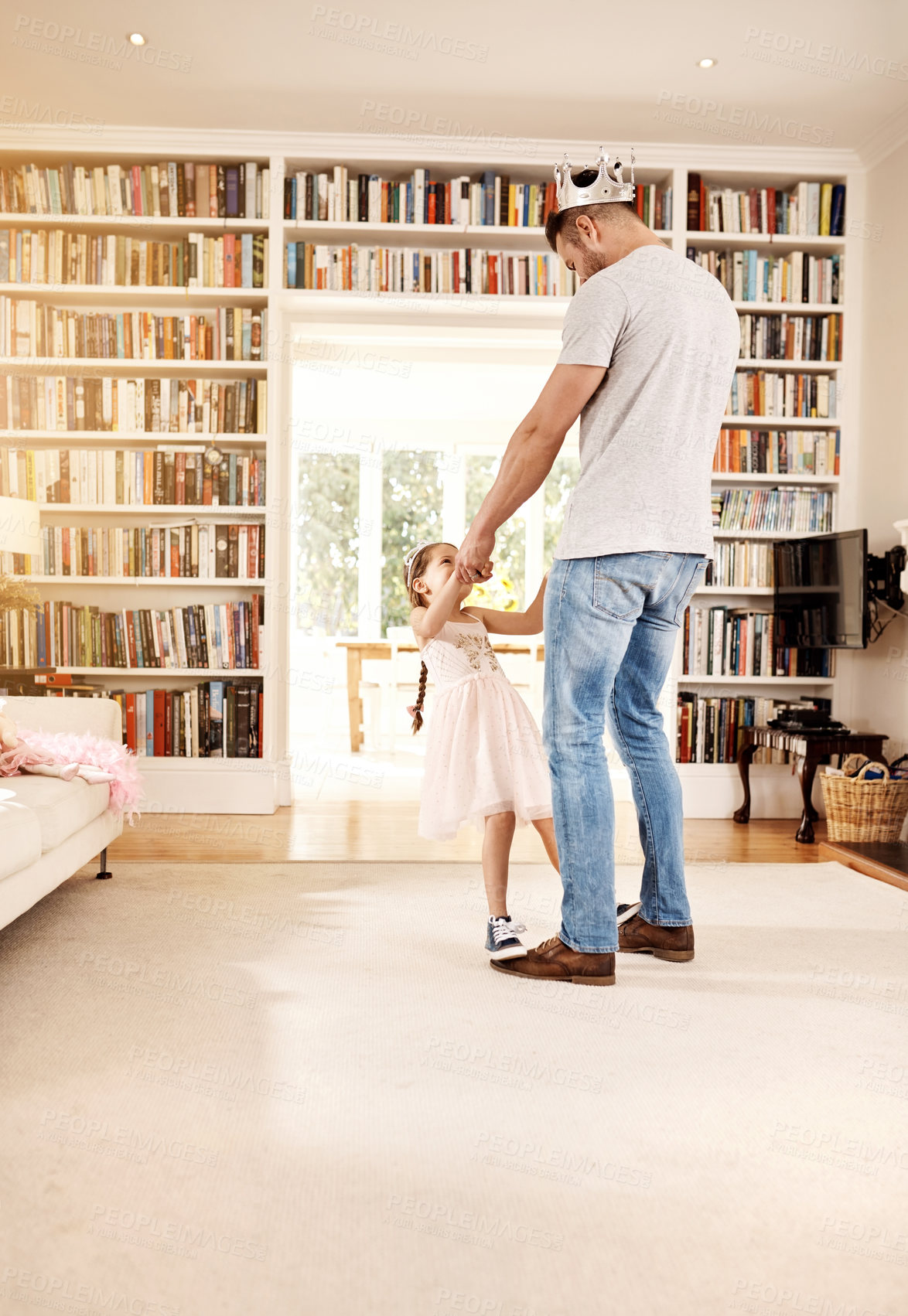 Buy stock photo Shot of a father dancing with his little daughter at home