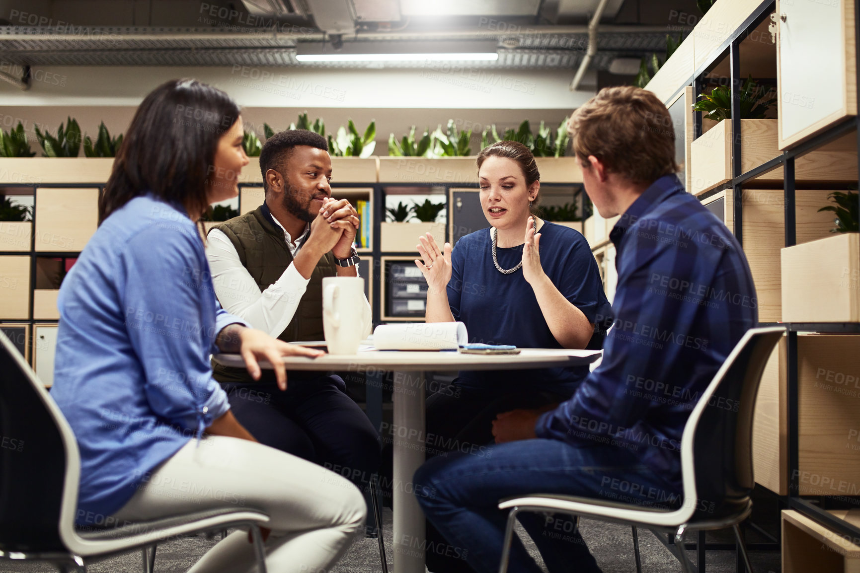 Buy stock photo Shot of a group of designers having a meeting in an office