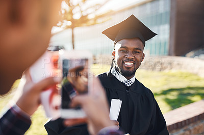 Buy stock photo Shot of a male student having his picture taken