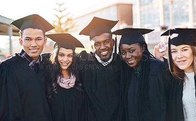 Buy stock photo Portrait of a group of students standing together on graduation day