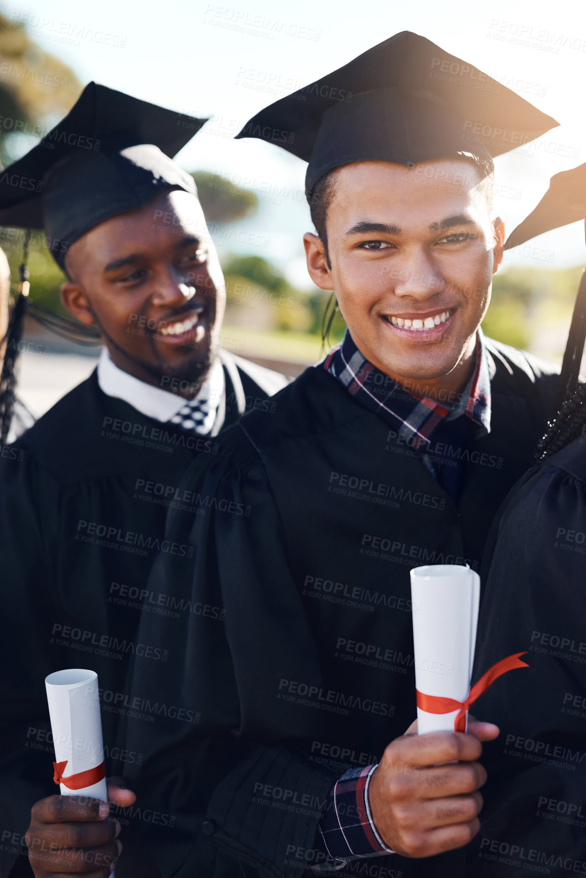 Buy stock photo Shot of students standing together on graduation day