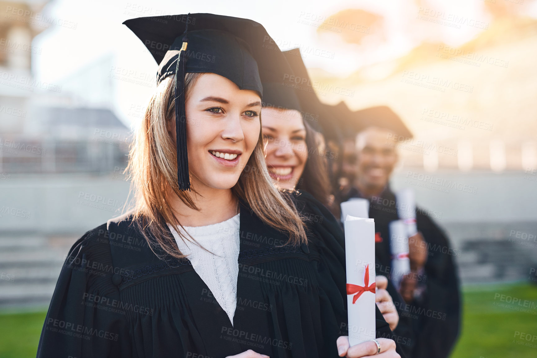 Buy stock photo Students, graduation and certificate with smile, line and together for memory, progress or celebration at college. Woman, friends and diploma for group, happy or excited at university for achievement