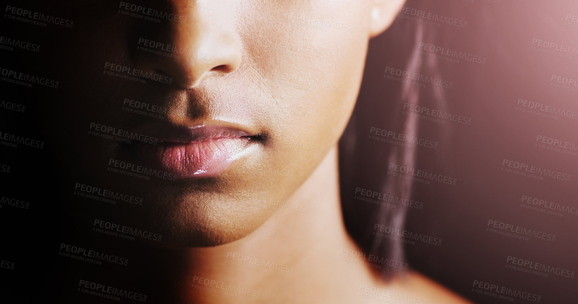 Buy stock photo Face, closeup of woman lips and in a black background for skincare with lens flare. Cosmetics or healthcare for skin, dermatology or treatment and female person in a studio backdrop with glow