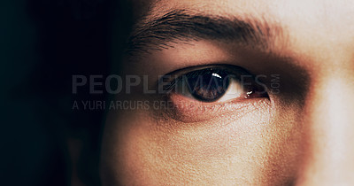 Buy stock photo Closeup shot of  man opening his eyes against a dark background