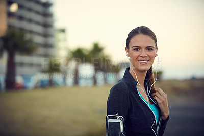 Buy stock photo Portrait of a sporty young woman exercising outdoors