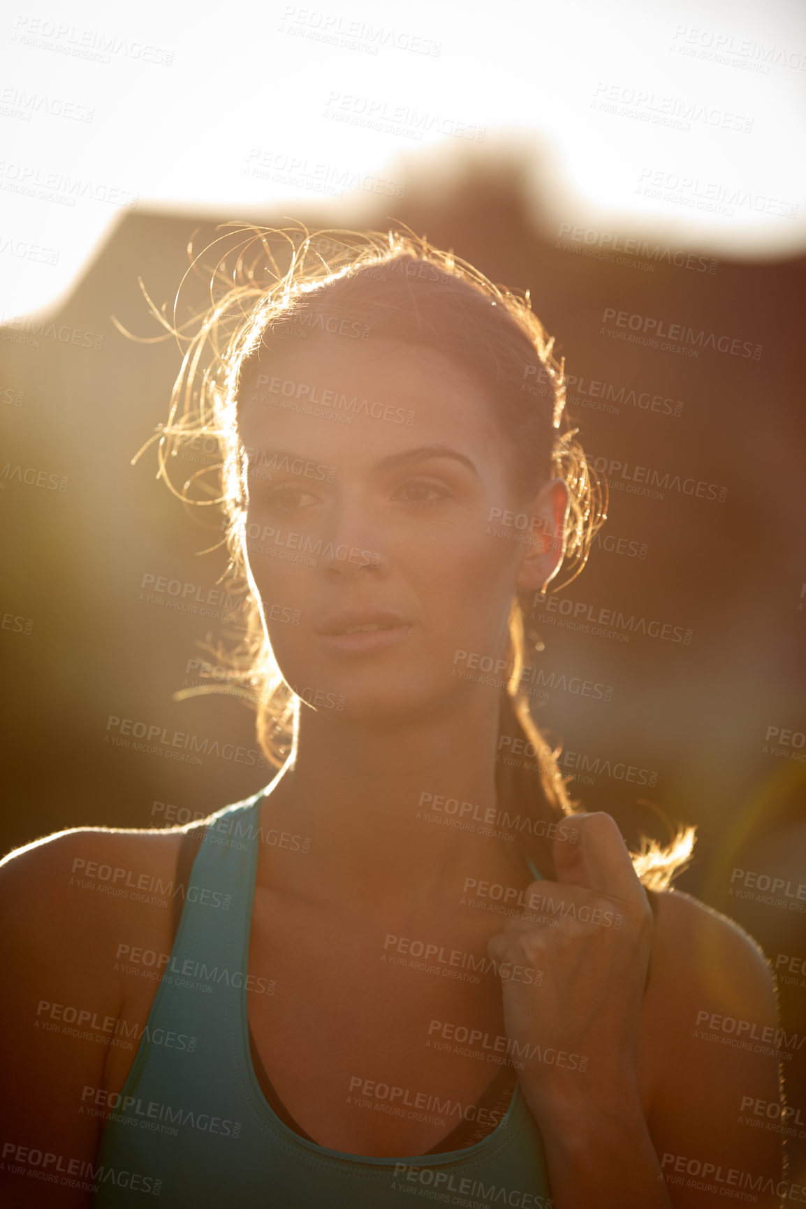 Buy stock photo Shot of a sporty young woman exercising outdoors