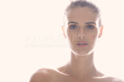 Buy stock photo Cropped shot of a beautiful young woman posing against a light background