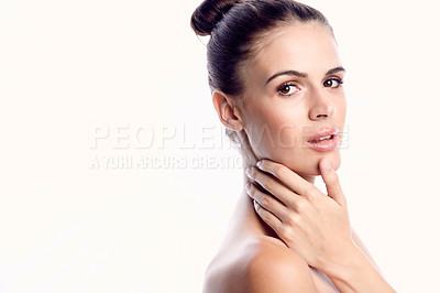Buy stock photo Cropped shot of a beautiful young woman posing against a light background