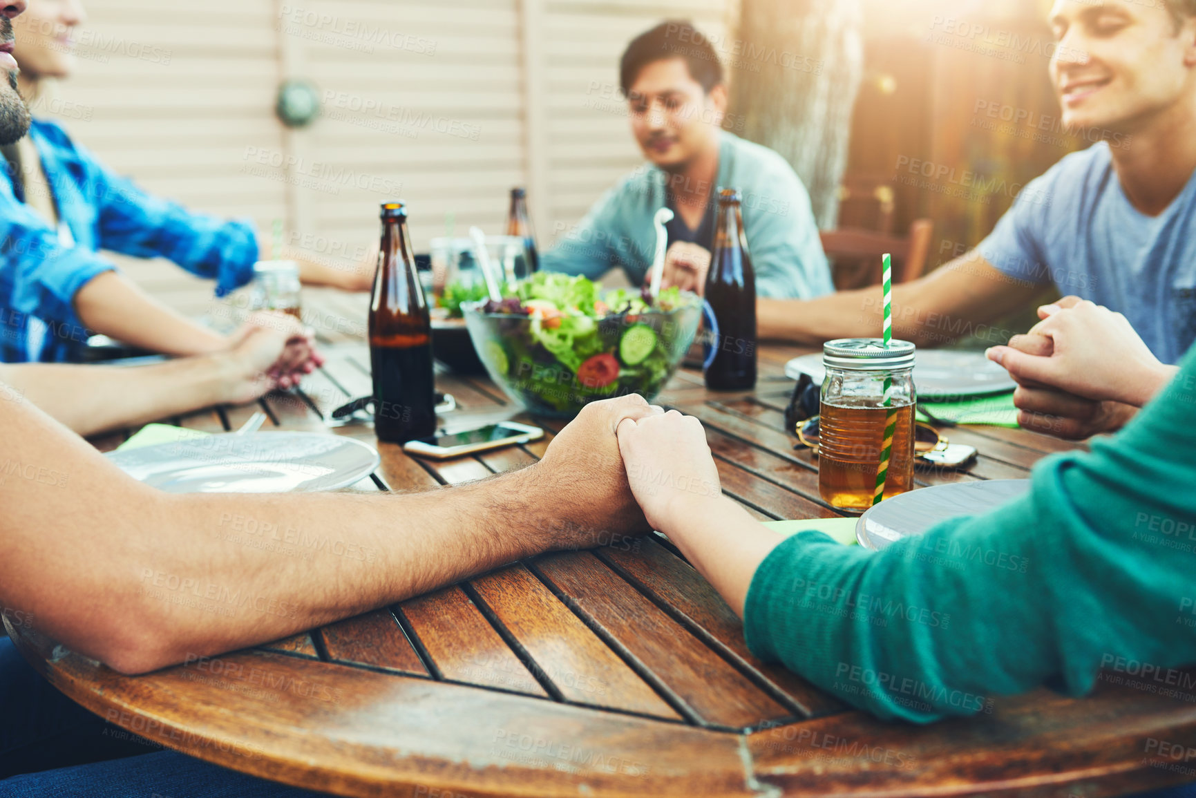 Buy stock photo Holding hands, party and prayer with friends outdoor in backyard together for social gathering. Grace, worship and thank you with group of people in garden of home for bonding, celebration or event