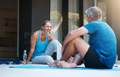 Buy stock photo Full length shot of a mature and happy couple taking a break after an intense workout session