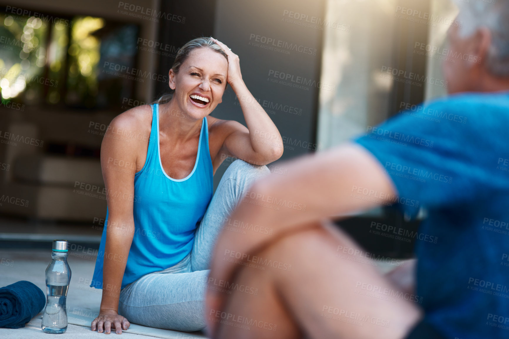 Buy stock photo Shot of a mature and happy couple taking a break after an intense workout session outside of their home
