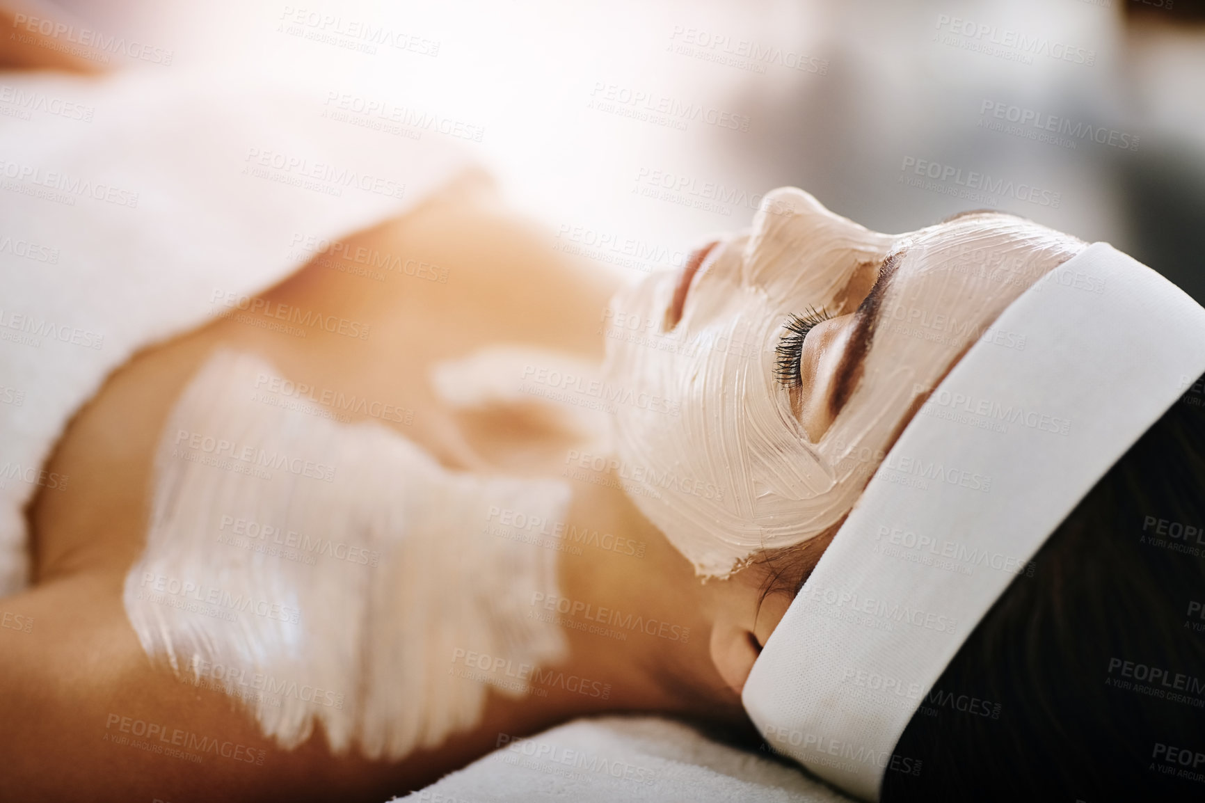 Buy stock photo Woman, spa and relax with mask on bed, above or care for wellness, clay and holiday at luxury resort. Person, cosmetics and application for skincare, minerals and exfoliation with benefits at lodge