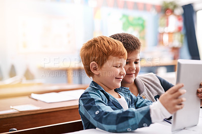 Buy stock photo Tablet, school and children with books in classroom for online learning, studying and knowledge. Education, academy and young boys with textbooks and digital tech for lesson, development and research