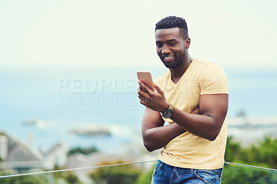 Buy stock photo Outdoor, space and black man on phone or social media, app or technology for email communication, mockup and blue sky. Smartphone, online networking or internet conversation on screen with smile