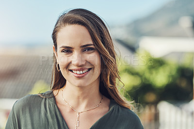 Buy stock photo Portrait of a cheerful young woman relaxing outdoors