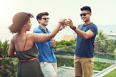Buy stock photo Shot of a group of friends having drinks and sharing a toast together outside while on holiday